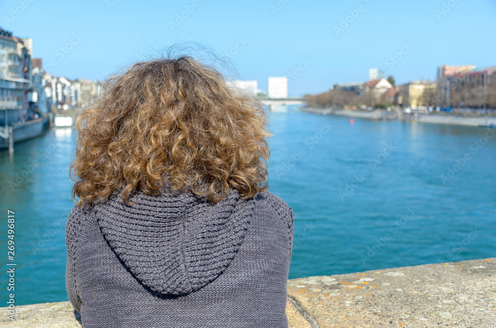 Woman standing enjoying a river view