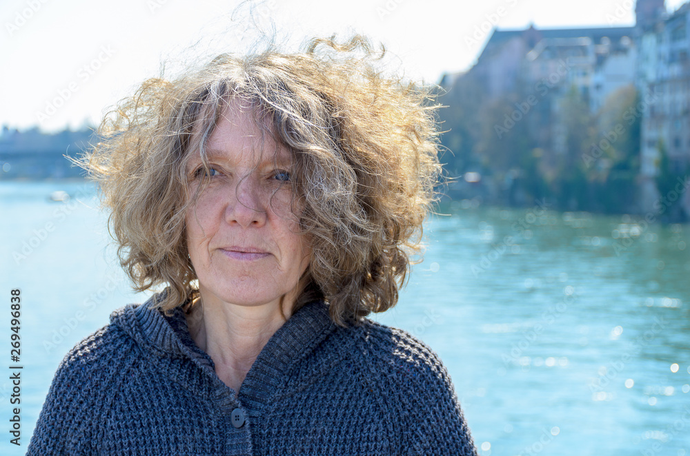 Woman with curly tousled hair outdoors Woman with curly tousled hair outdoors