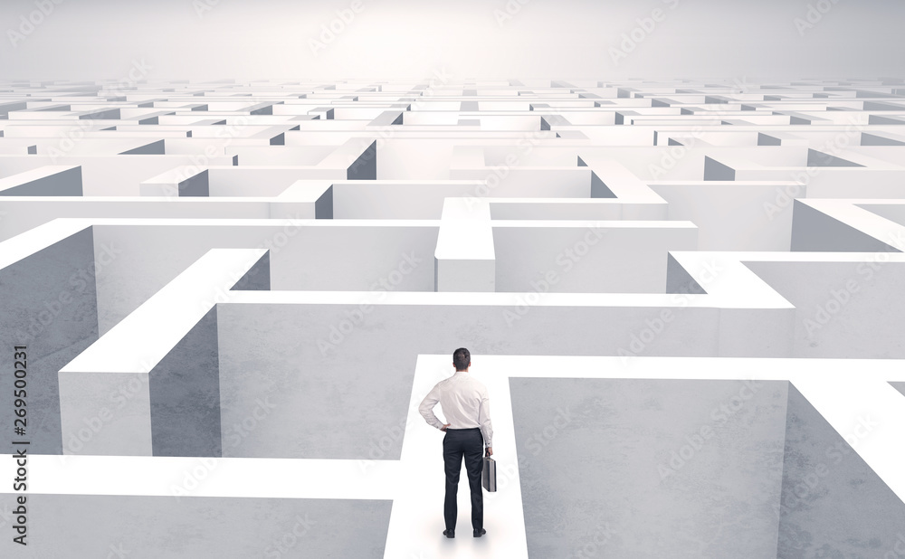 Small businessman in a middle of a huge maze
Small businessman in a middle of a huge maze