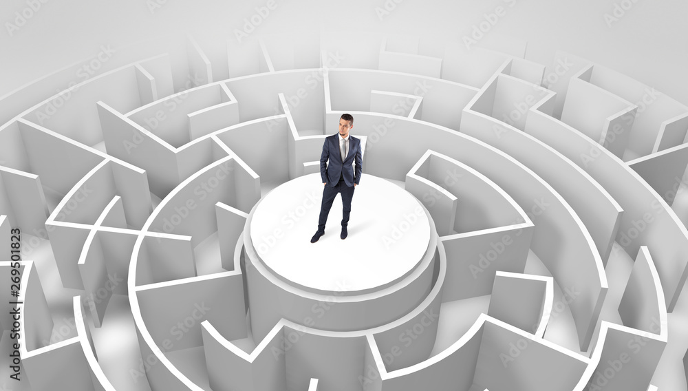 Businessman standing on the top a maze and looking through
Businessman standing on the top a maze and looking through
