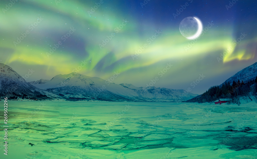 Aurora Borealis in Tromso, Norway in front of the Norwegian fjord, winter season.