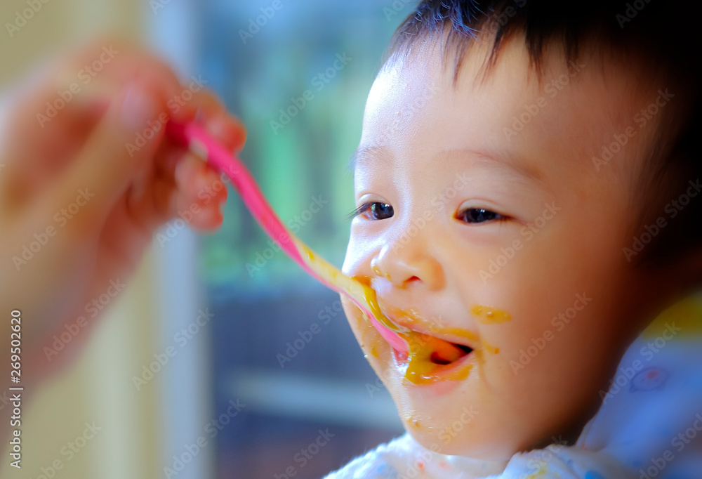 Enjoy eating : Asia baby boy enjoy eating food Enjoy eating : Asia baby boy enjoy eating food
