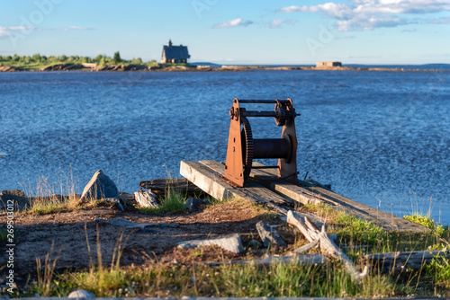 The hull of the old winch on the shore in the village of Rabocheostrovsk, Kem.  White Sea, Kemsky District, Republic of Karelia, Russia © Konstantin