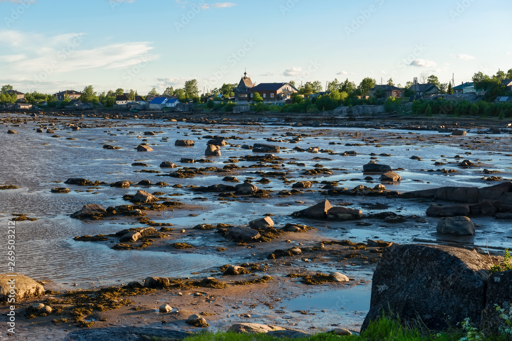 Village of Rabocheostrovsk, Kem. White Sea at low tide. Kemsky District, Republic of Karelia, Russia
