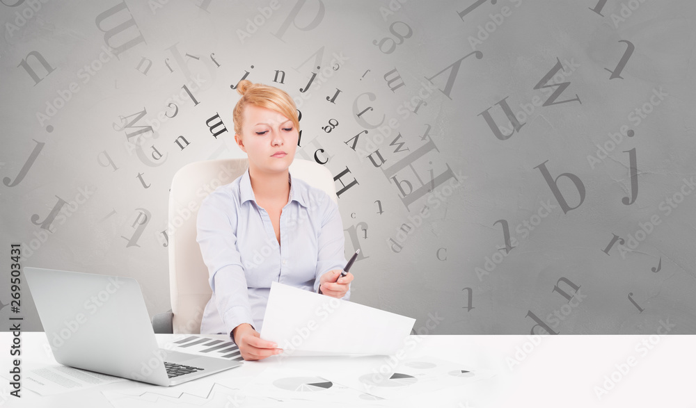 Business person sitting at desk with editorial and letters concept
Business person sitting at desk with editorial and letters concept