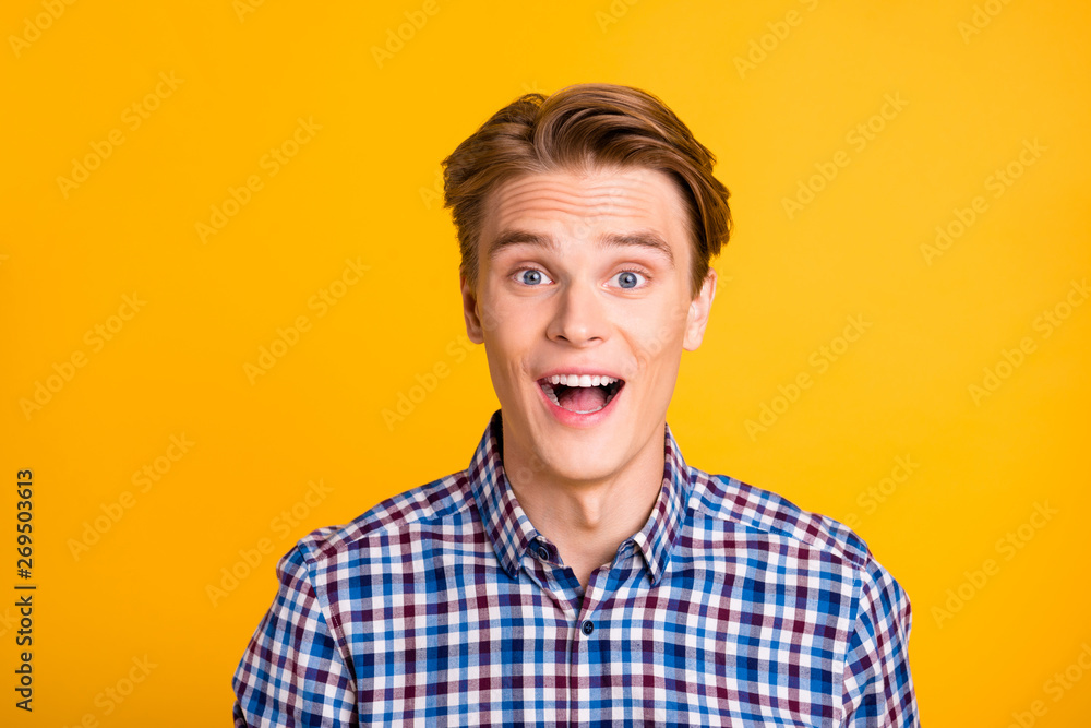 Close up photo amazing youngster he him his man excited not believe eyes achievement perfect styling ready for new beginning wear casual plaid checkered shirt outfit isolated yellow bright background