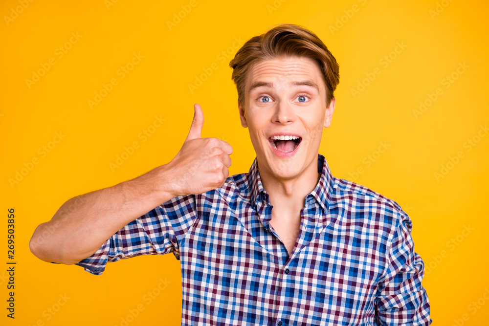 Close up photo attractive amazing he him his man hand arm finger up tested quality advising buy buyer product perfect hair wear casual plaid checkered shirt outfit isolated yellow bright background Close up photo attractive amazing he him his man hand arm finger up tested quality advising buy buyer product perfect hair wear casual plaid checkered shirt outfit isolated yellow bright background