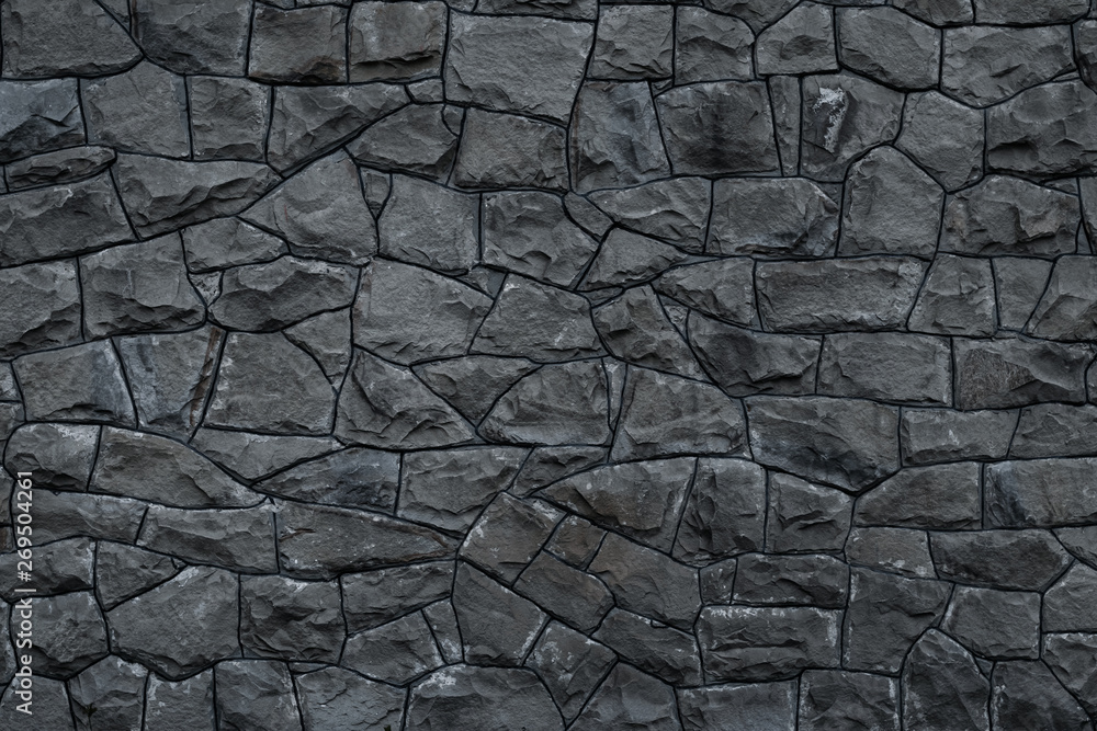 Gray dirty stone wall. Texture of grey granite. Dark rough rocks background.  Weathered dark gray grunge building's facade. Stone surface. Mosaic pattern  of grey stones on the cement wall. Photos | Adobe