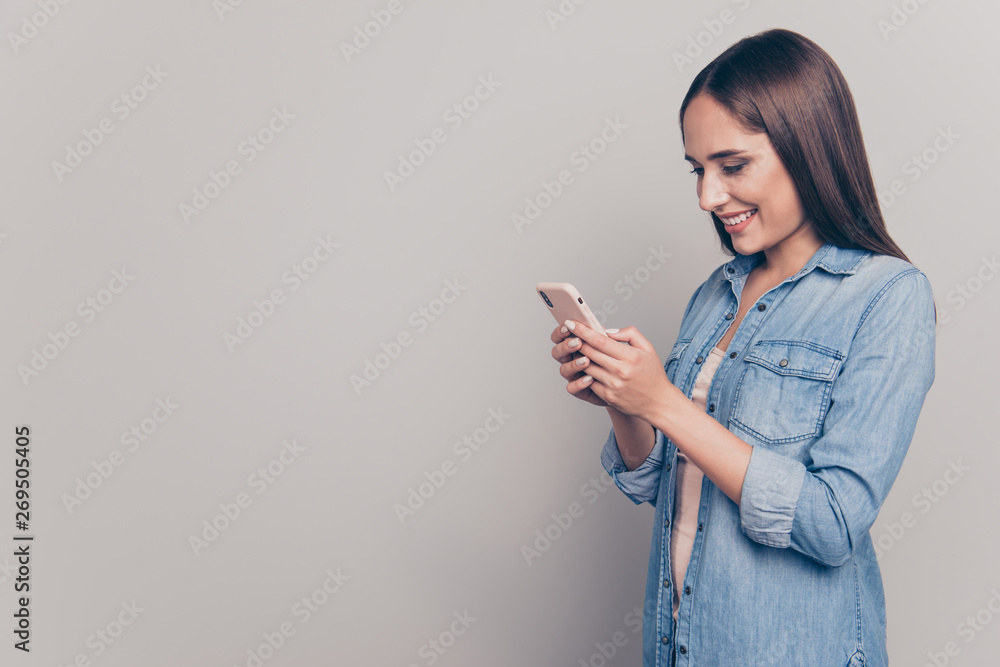 Profile side view portrait of her she nice attractive lovely cheerful cheery straight-haired lady holding in hands device web surfing copy space isolated over light white gray background Profile side view portrait of her she nice attractive lovely cheerful cheery straight-haired lady holding in hands device web surfing copy space isolated over light white gray background