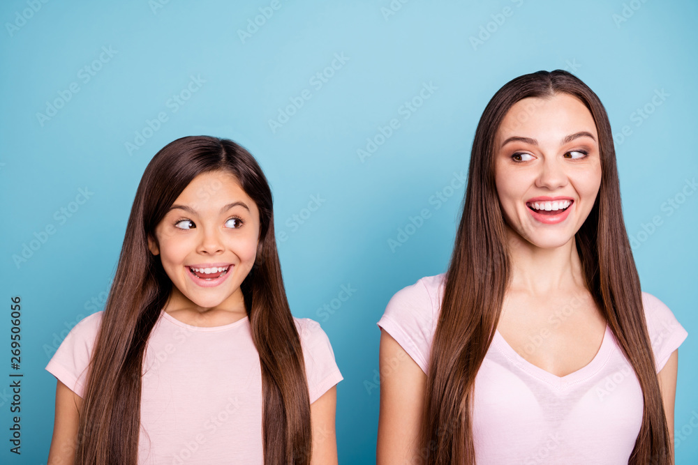 Close-up portrait of two nice-looking sweet cute charming attractive lovely cheerful straight-haired girls looking at each other isolated over bright vivid shine green blue turquoise background Close-up portrait of two nice-looking sweet cute charming attractive lovely cheerful straight-haired girls looking at each other isolated over bright vivid shine green blue turquoise background