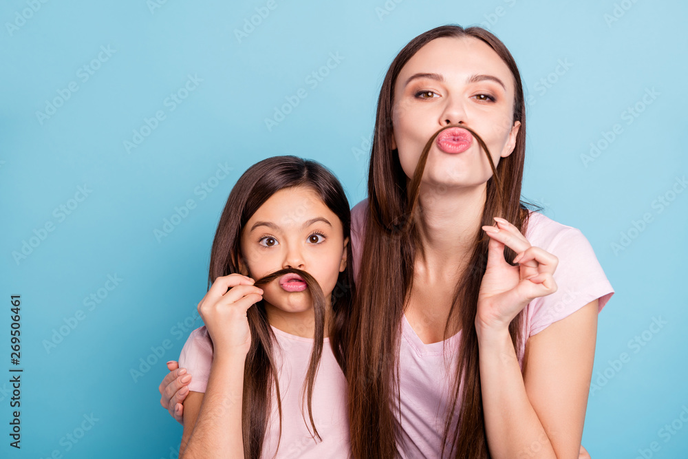 Close-up portrait of two nice charming attractive lovely winsome girlish playful cheerful cheery straight-haired girls having fun fooling isolated on bright vivid shine blue turquoise background Close-up portrait of two nice charming attractive lovely winsome girlish playful cheerful cheery straight-haired girls having fun fooling isolated on bright vivid shine blue turquoise background