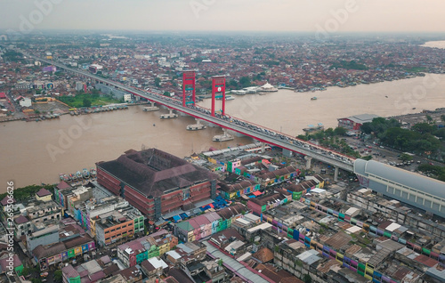 Aerial view of Ampera bridge over Musi river in Palembang city of Indonesia. photo
