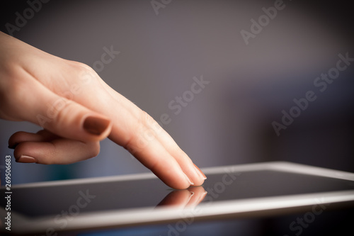 Hand holding tablet with drawn multimedia and application icons
