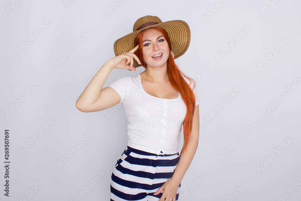Redhair woman in summer straw hat Redhair woman in summer straw hat