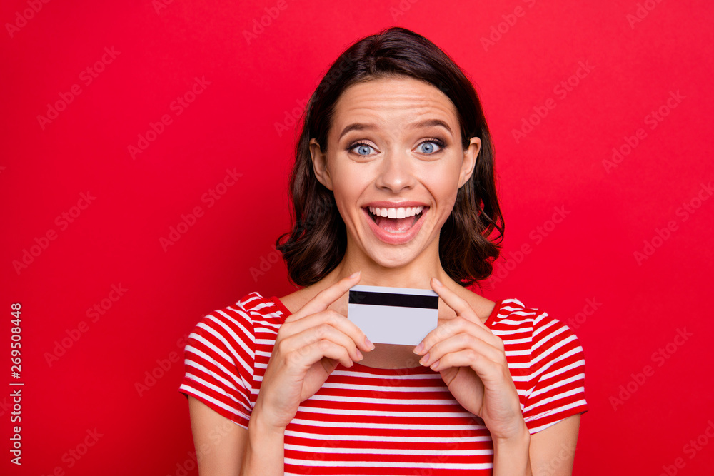 Portrait of funny funky teen teenager hold hand have credit card want bargain astonished impressed information shopper incredible wonder isolated dressed modern youth outfit isolated red background Portrait of funny funky teen teenager hold hand have credit card want bargain astonished impressed information shopper incredible wonder isolated dressed modern youth outfit isolated red background