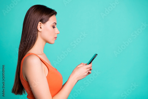 Profile side view photo concentrated attractive lovely millennial hold hand blog blogger work worker freelancer dialogue social network account intelligent youth clothing isolated green background