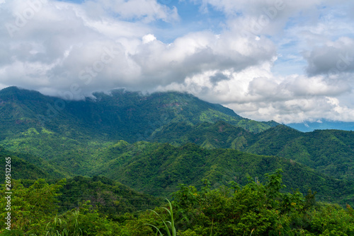 Blue sky high peak mountains fog hills mist scenery national park views at Phu Tub Berk, Khao Koh, Phetchabun Province, Thailand