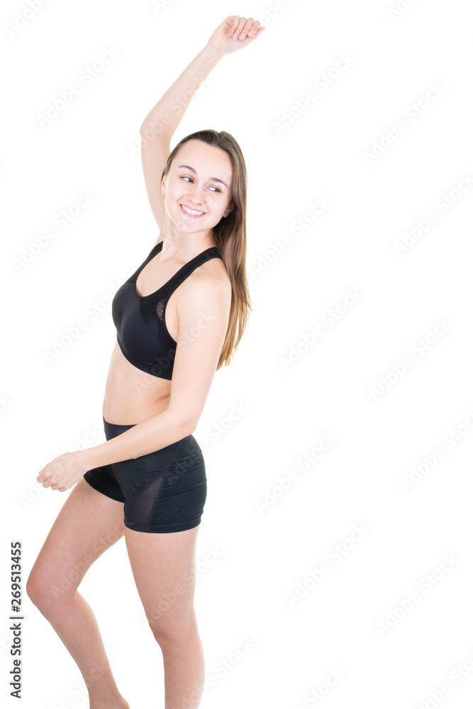 Young sporty beautiful slim woman stretching arms on side isolated in white background Young sporty beautiful slim woman stretching arms on side isolated in white background