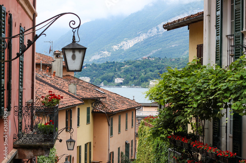 Fototapeta Naklejka Na Ścianę i Meble -  The colorful street of Bellagio with view to Como lake, Bellagio, Italy
