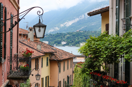 The colorful street of Bellagio with view to Como lake, Bellagio, Italy