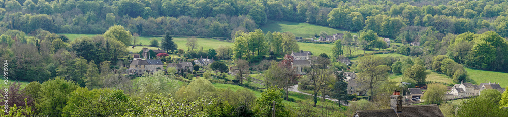 View across Sheepscombe with village church, St John the Apostle, The Cotswolds,United Kingdom