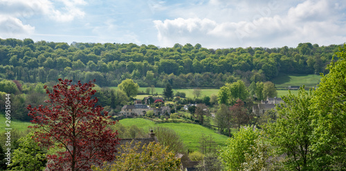 View across Sheepscombe with village church, St John the Apostle, The Cotswolds,United Kingdom