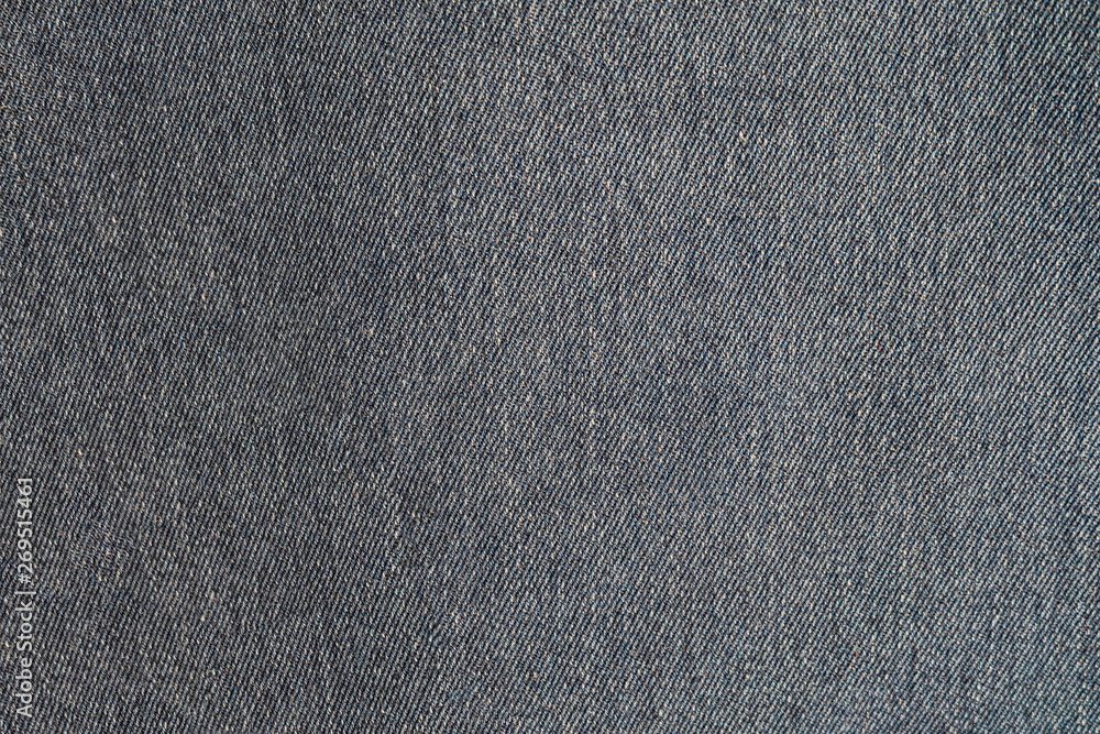 Gray blue denim texture. Dark jeans close-up. Gray blue denim texture. Dark jeans close-up.