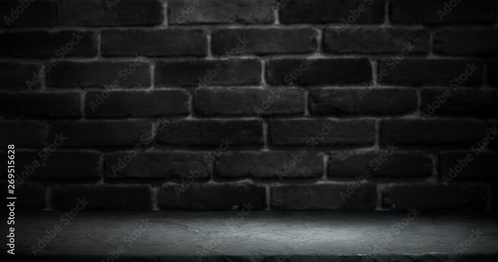 Old wooden table with brick background dark Old wooden table with brick background dark