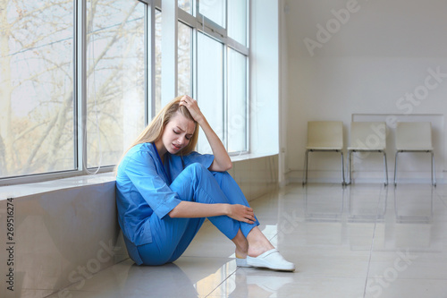 Depressed female medical as...
