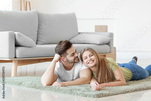 Young couple resting on sof...
