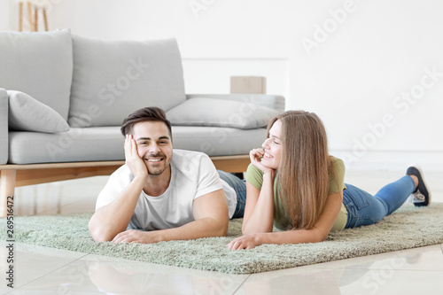 Young couple resting on sof...