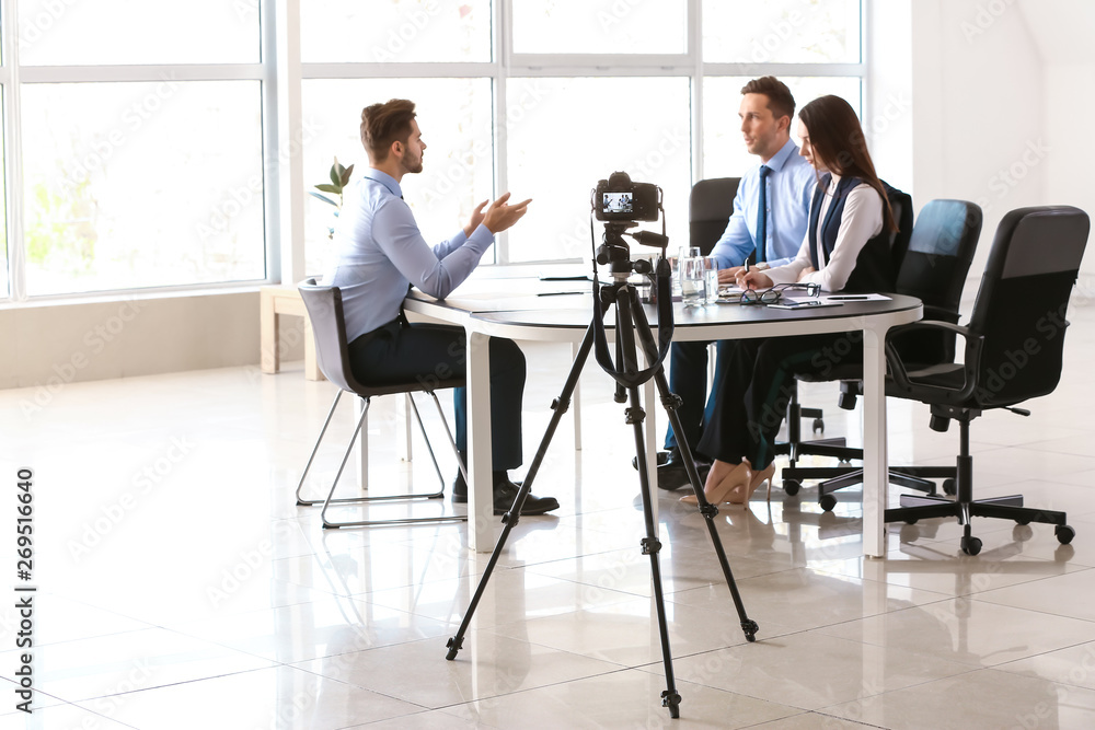 Human resources commission interviewing man in office Human resources commission interviewing man in office