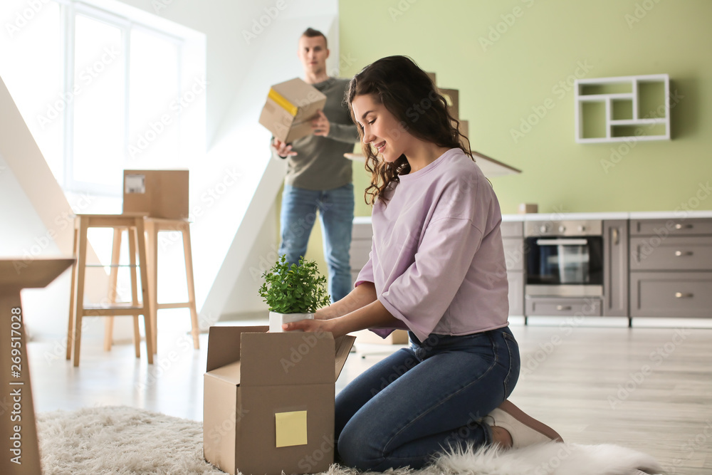 Adorable loving couple after moving into new house Adorable loving couple after moving into new house