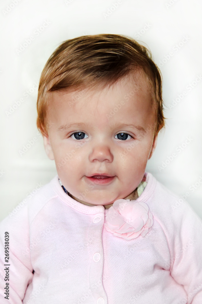 portrait of a little girl on a white background