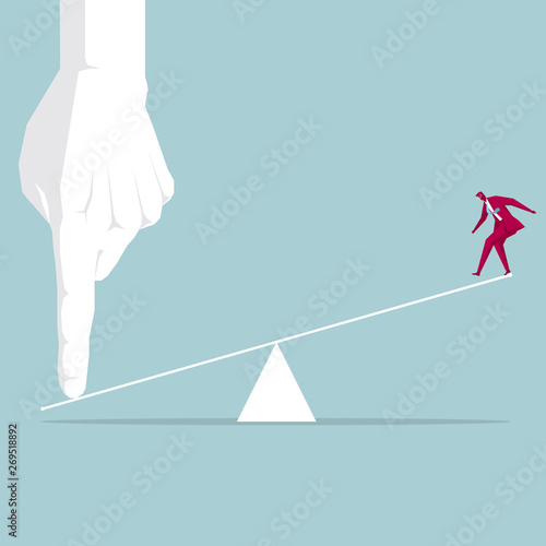 Businessman being tilted up. Isolated on blue background.