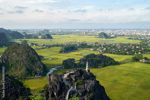 Panoramic view from the top of Mua mountain to a beautiful rock landscape of Ninh Binh and Tam Coc river in Vietnam.