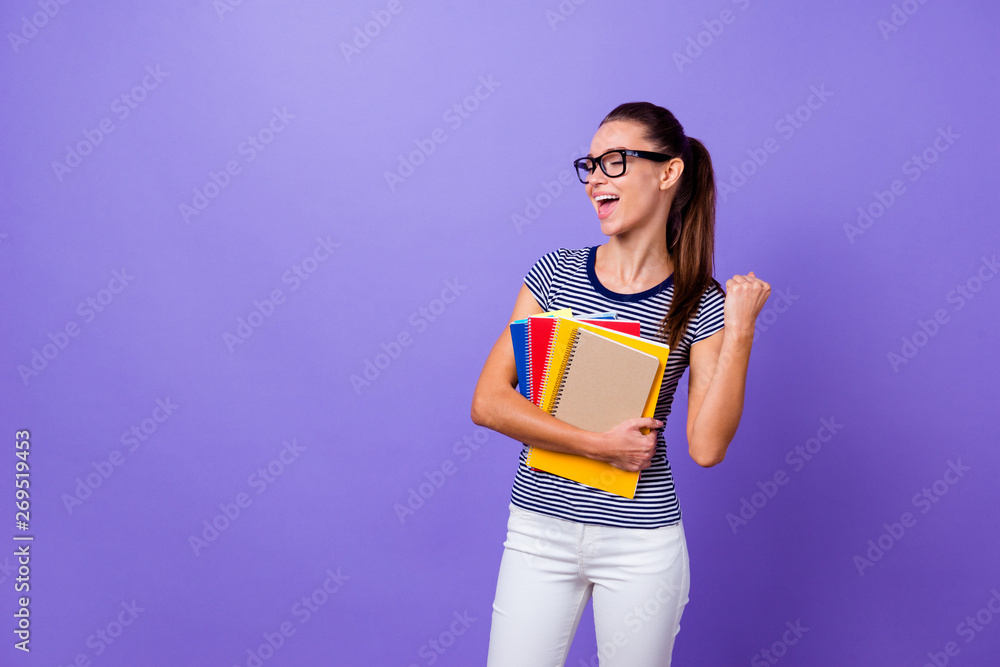 Portrait of her she nice-looking attractive lovely charming cute cheerful cheery girl holding in hands books showing satisfaction gesture isolated over violet purple vivid shine bright background Portrait of her she nice-looking attractive lovely charming cute cheerful cheery girl holding in hands books showing satisfaction gesture isolated over violet purple vivid shine bright background