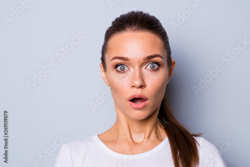 Close up photo beautiful amazing pretty she her lady big great eyes full fear staring stupor open mouth unexpected news epic fail lost loser wear casual white t-shirt isolated grey background