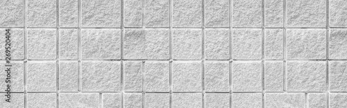 Panorama of White stone block wall pattern and seamless background