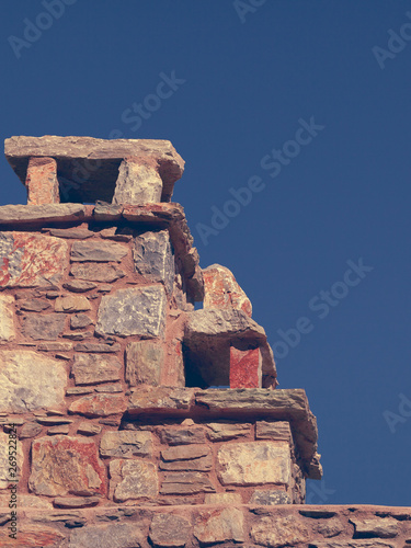 Stone amde chimney on roof photo