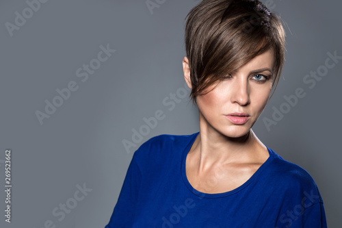 Beautiful brunette woman with short hair, studio shot