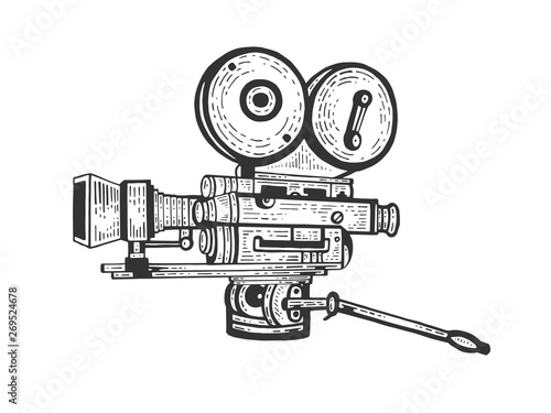 Old movie camera engraving vector illustration. Scratch board style imitation. Hand drawn image.