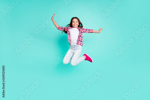 Full length body size view photo lovely nice kid have funny funky enjoy content rejoice trip travel vacation trendy stylish move raise hands checkered clothing isolated turquoise background