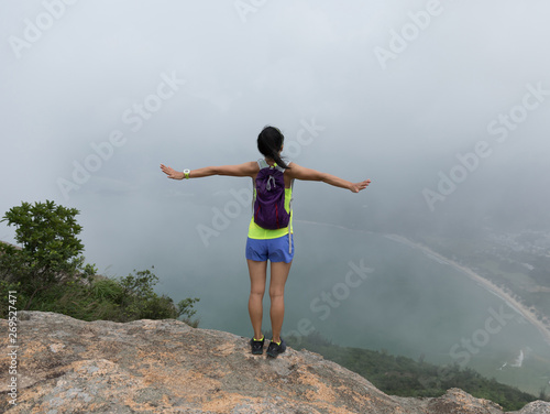 Wallpaper Mural Successful Woman Hiker feel free In Seaside Mountain Top Torontodigital.ca