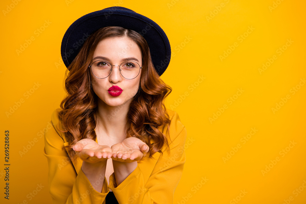 Close-up portrait of her she nice charming cute attractive lovely lovable sweet chic positive wavy-haired lady wearing yellow blazer sending kiss isolated on bright vivid shine orange background Close-up portrait of her she nice charming cute attractive lovely lovable sweet chic positive wavy-haired lady wearing yellow blazer sending kiss isolated on bright vivid shine orange background
