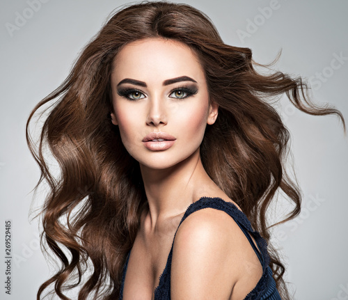 Face of a beautiful woman with long brown hair