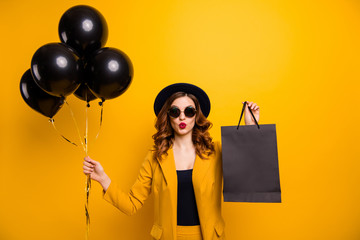 Close up photo beautiful she her lady vacation abroad send air kiss carry packs perfect look buy buyer present gift balloons sale discount wear specs formal-wear suit isolated yellow bright background