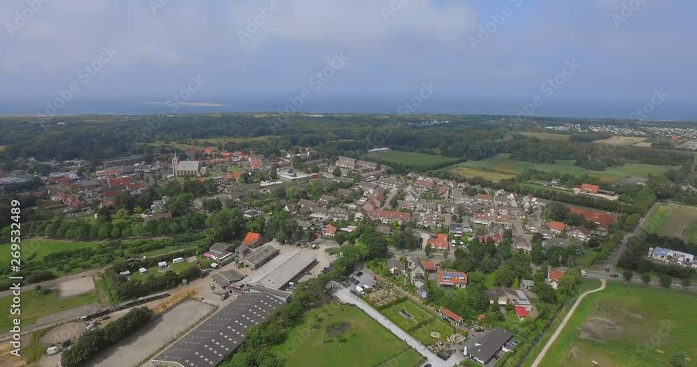 The small touristic town Renesse in the Netherlands during a light overcast day in summer. Aerial shot. The small touristic town Renesse in the Netherlands during a light overcast day in summer. Aerial shot.
