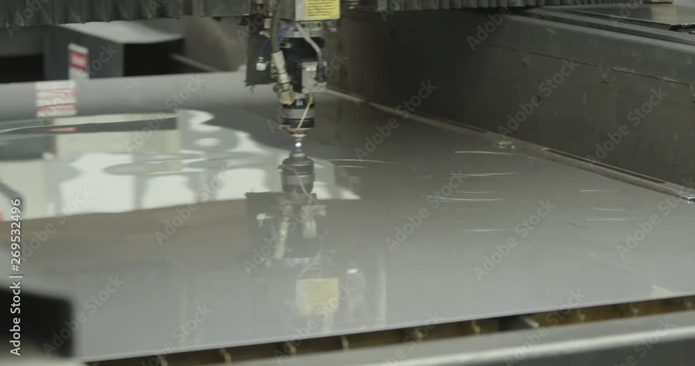 Laser cutter cutting metal plates. Laser cutter cutting metal plates.