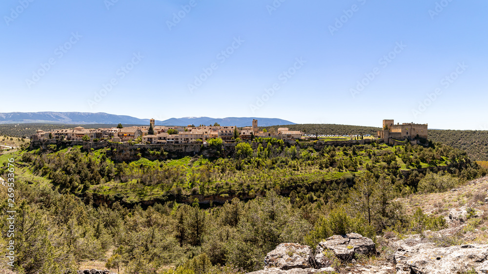 Pedraza, Castilla Y Leon, Spain: panorama of Pedraza village from Mirador the Tungueras, with the Sierra de Guadarrama behind. Pedraza is one of the best preserved medieval villages of Spain